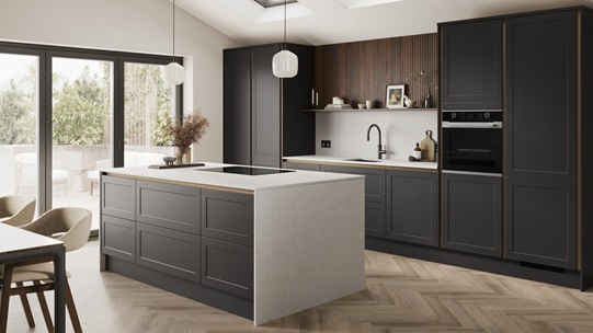 A charcoal black, shaker kitchen island in a handleless style & matt finish. It has quartz worktops with matching panels. 