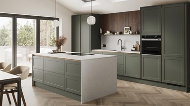 An ash green, shaker kitchen island in a matt finish & handleless style. It has quartz worktops with side panels & backboard