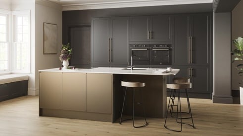 A Frome kitchen island layout, with charcoal black units and matt metallic island units. It is finished with oak flooring.