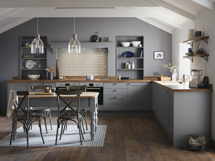 Farmhouse style shaker kitchen in slate grey with square edge wood worktop and classic wooden top dining table.