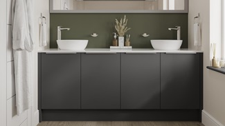 Black bathroom with charcoal tones and simple matt finish for a bold aesthetic. Includes white worktops for a two-tone look.