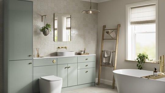 A reed green bathroom with a gloss finish and brass handles. It has contemporary stone-effect flooring and wall tiles. 