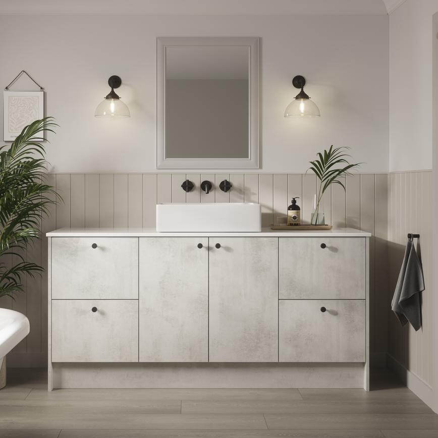 A Hockley bathroom with white, textured stone-effect cabinets & black hardware. It has painted wall panels  & oak flooring.  