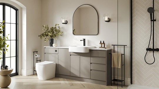 A sand grey, integrated handle bathroom in a single wall layout. The are also white counters and herringbone flooring.