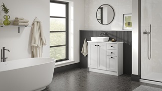 A single-wall, shaker bathroom in a dove grey tone. It has tile flooring, a ceramic sink, and dark oak wall panelling.