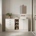 A single-wall, shaker bathroom in a porcelain tone. It has a white worktop, a small ceramic sink, and handles and taps.