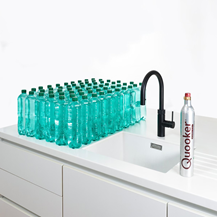 Black Quooker tap and filter cartridge on white cut out sink