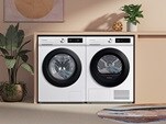 Samsung laundry products built into cabinetry showing orange walls and indoor plants