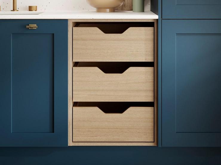 A marine blue shaker kitchen with storage drawers
