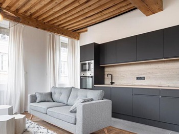 matt black kitchen with integrated handle doors and light oak worktops