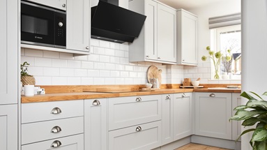 A wide shot of Ellen White's dove grey Howden's kitchen