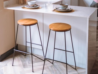 White quartz breakfast bar with a waterfall design in a grey kitchen