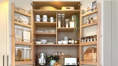Larder storage in a cream slab kitchen