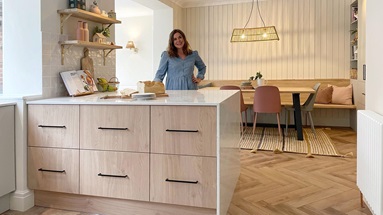 Sophie Clovis in kitchen behind a kitchen island