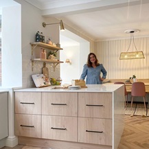 Sophie Clovis in kitchen behind a kitchen island
