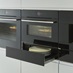 Bosch Series 8 Compact Oven with Microwave and Series 8 Warming Drawer Open