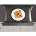 Miele ESW7010 warming drawer with a plate of cooked food