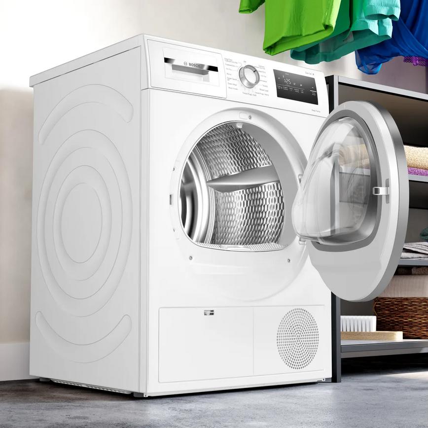 Freestanding 9kg Heat Pump Tumble Dryer In A Laundry Room Door Open