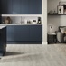 Howdens Premium Professional V Groove Pastel Grey Laminate Flooring in a Greenwich Marine Blue Handleless Kitchen Set