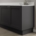 Charcoal 15mm continuous plinth fitted with base cabinet and white worktop