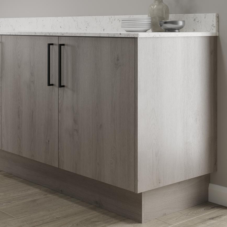 Light grey oak return plinth fitted with base cabinet and white worktop