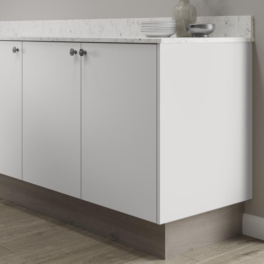 White light oak return plinth fitted with base cabinet and white worktop
