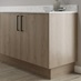Natural oak continuous plinth fitted with base cabinet and white worktop
