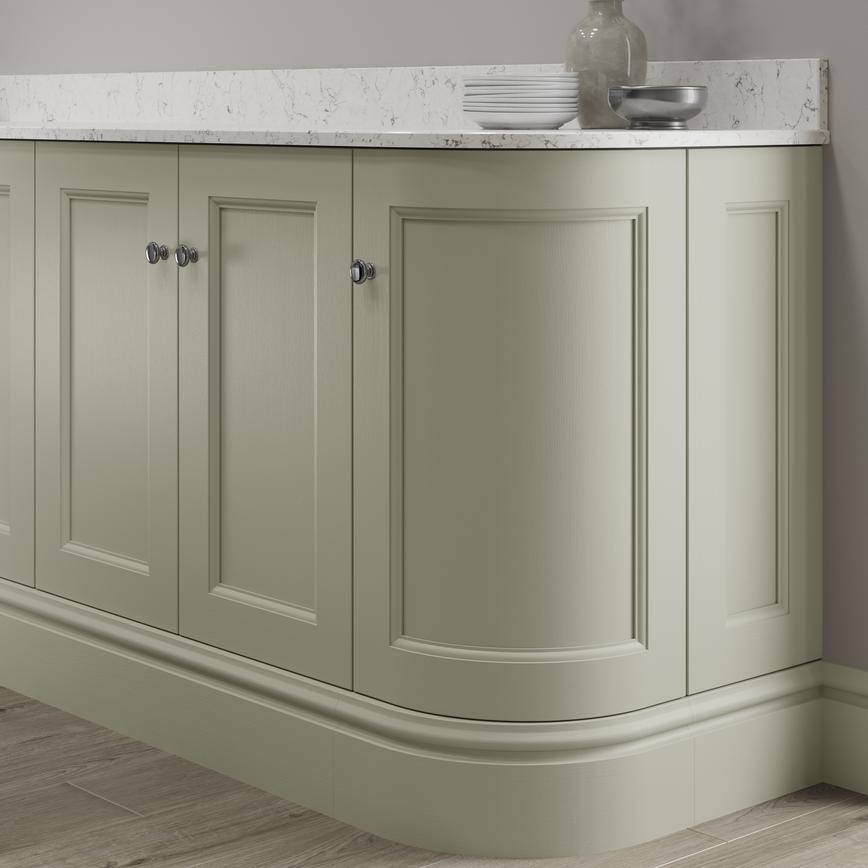 Elmbridge sage green decorative curved plinth fitted with base cabinet and white worktop