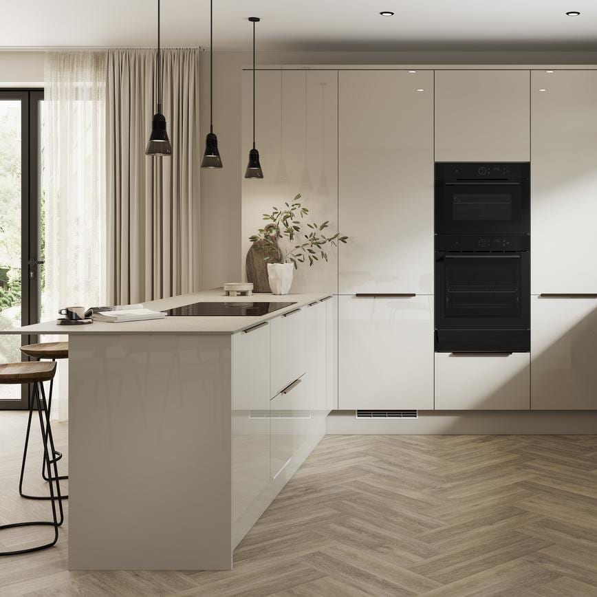 A sandstone kitchen from the Winterton gloss collection. It has a u-shaped layout and is mix-and-matched with dark stone cabinets.