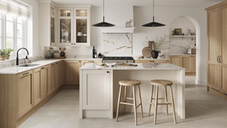An oak l-shaped kitchen with a white shaker island. It has stone-effect flooring, range cooker, and electric hob.
