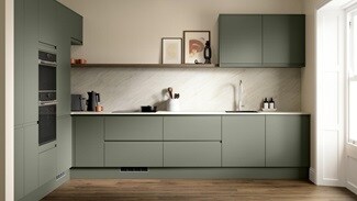 A modern dark ash green kitchen with integrated handles. It is in an l-shape layout with white stone worktops and back panel.