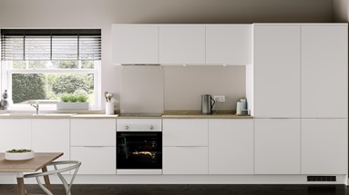 Simple white kitchen idea in a single wall layout. Includes a built-under electric oven, glass splashback, and oak worktops.