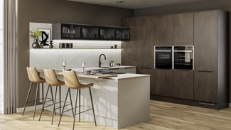 A contemporary two-tone kitchen with dark stone, cream slab doors, black handles, glazed wall units, and timber floors