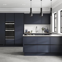 Linear-style navy kitchen with matt-black trims. A galley layout with white worktops, induction hob and built-in double oven.