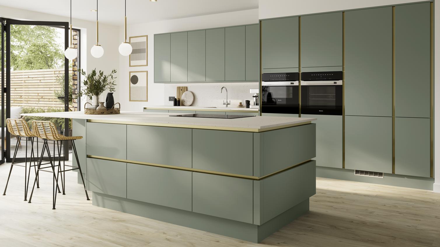 Pale, reed green kitchen in an island configuration in a matt finish. Includes handleless cabinets with brushed nickel trim.