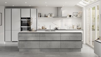 Open-plan kitchen with island and handleless concrete-effect doors. Contains matt-black metal trims for an industrious look.