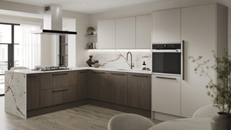 An l-shaped kitchen with cabinets in texted, walnut tones and white larder doors. It has marble worktops and backsplash.