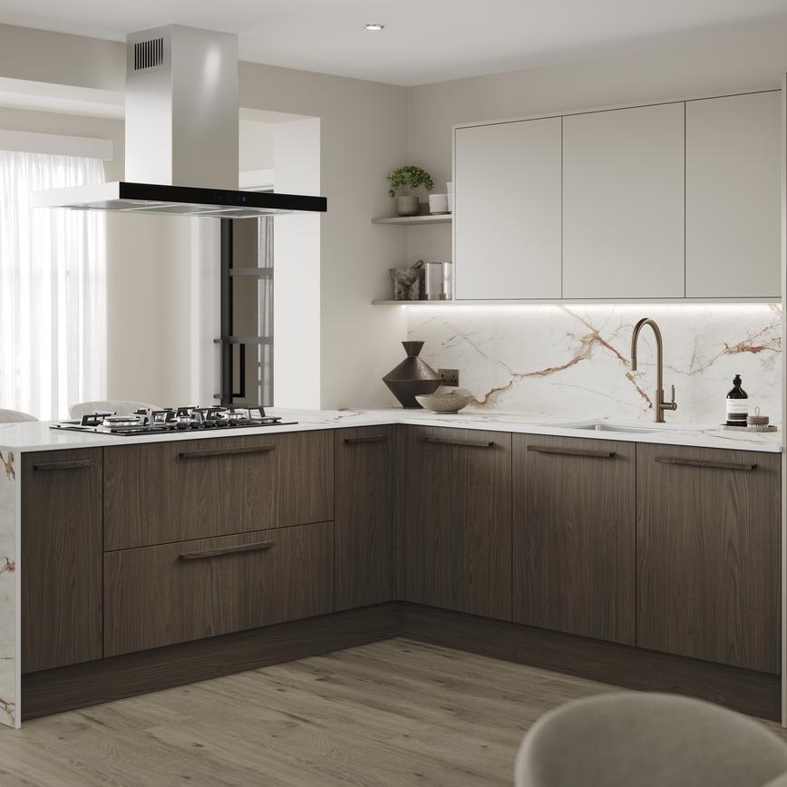 An l-shaped kitchen with cabinets in texted, walnut tones and white larder doors. It has marble worktops and backsplash.