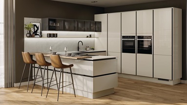 Peninsular kitchen layout with neutral slab doors in a glossy finish. Has handleless units and black trims for a modern look.