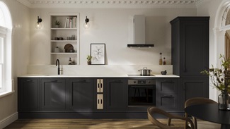 An Ilfracombe black shaker kitchen in a single-wall layout. It has black accessories and a marble-style worktop with upstand