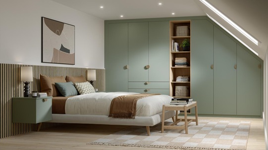 A modern bedroom with matt, reed green wardrobe doors and drawers. Behind the bed is dark wood panels and oak flooring.