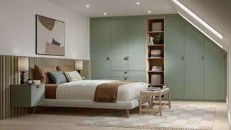 A modern bedroom with matt, reed green wardrobe doors and drawers. Behind the bed is dark wood panels and oak flooring.