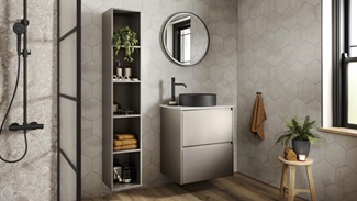 A titanium bathroom with a metallic effect and matt finish. There is a black shower unit, matching sink, and oak flooring.