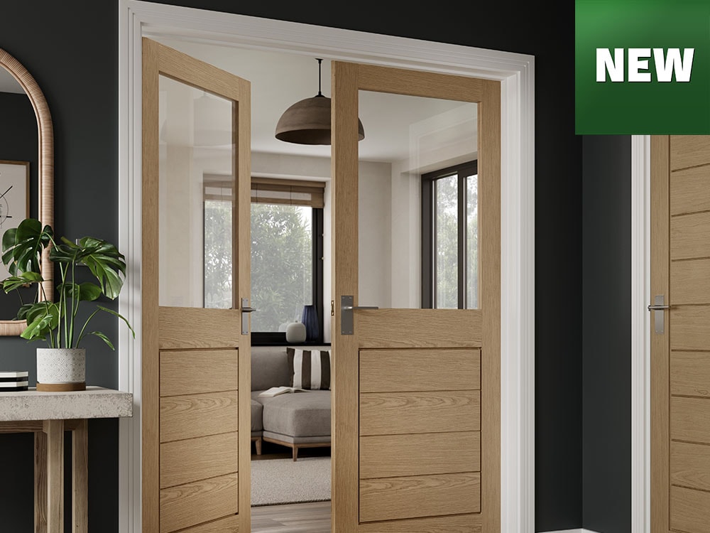 Pair of new glazed wooden interior doors leading into a living space.