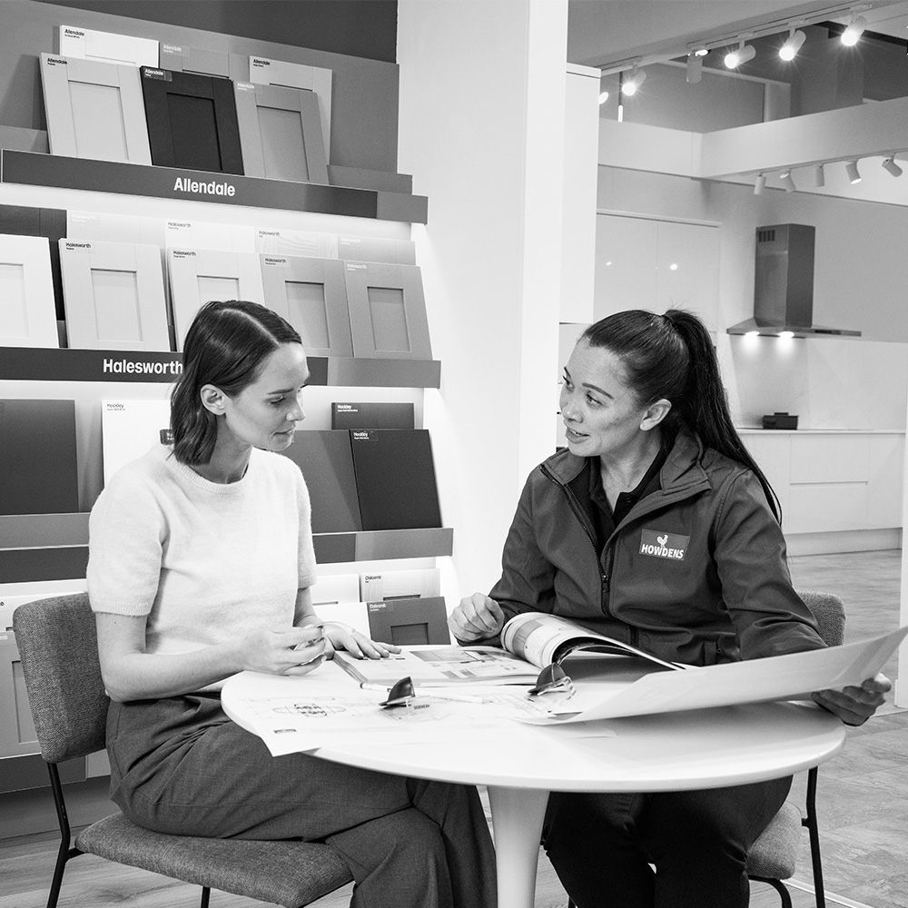 Customer choosing a kitchen with designer