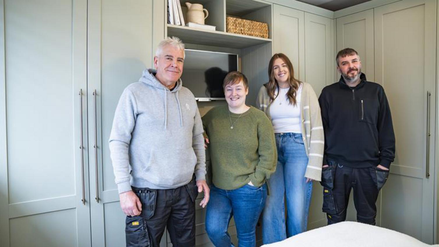 Painted wall panelling with matching skirting and rails. The bedroom door is painted in the same brown colour.